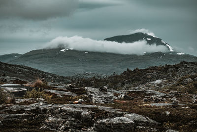 Scenic view of snowcapped mountains against sky