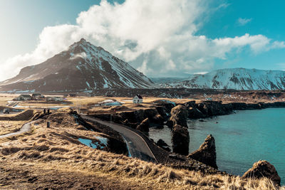 Panoramic view of snowcapped mountains against sky