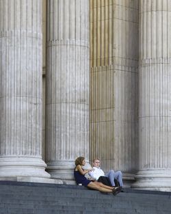 Side view of a woman resting on floor