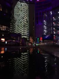 Illuminated buildings in city at night