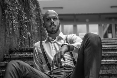 Young man sitting outdoors