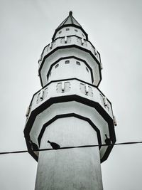 Low angle view of old tower against sky
