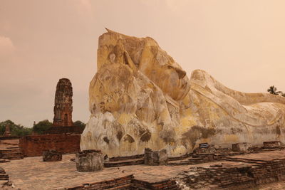 Reclining buddha statues at ayuthaya province during sunset