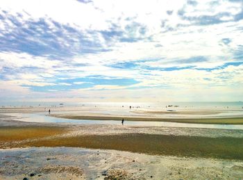 Scenic view of sea against cloudy sky