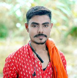 Portrait of young man standing outdoors