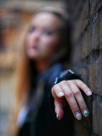 Portrait of woman holding hands