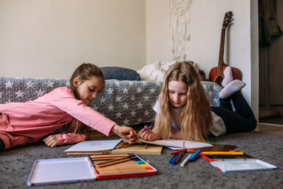 High angle view of mother and daughter at home