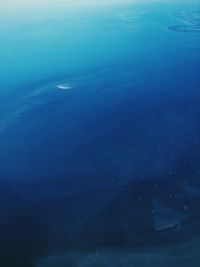 Scenic view of sea against blue sky