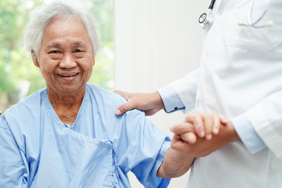 Portrait of doctor with patient in hospital