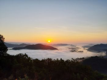 Scenic view of mountains against sky during sunset