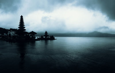 Scenic view of building against cloudy sky