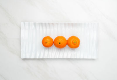 High angle view of orange fruits on table