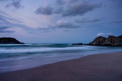 Scenic view of sea against sky at dusk