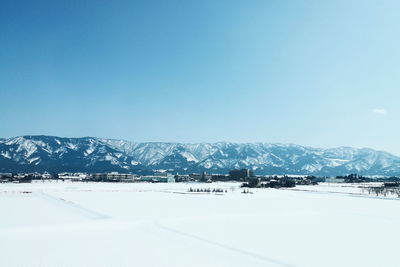 Scenic view of snowcapped mountains against sky