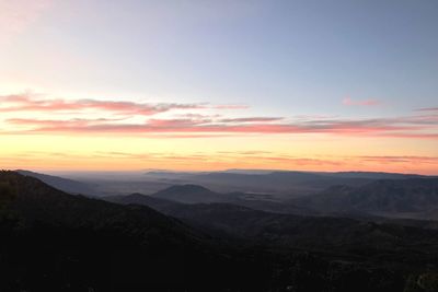 Scenic view of mountains against sky during sunset