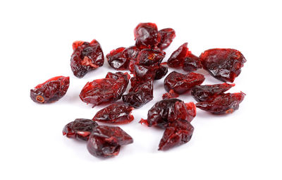 Close-up of dried fruits against white background