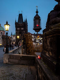 Illuminated buildings in city at dusk