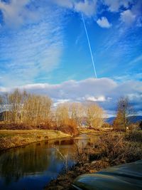 Scenic view of vapor trails against sky