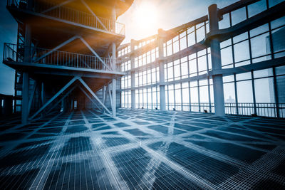 Low angle view of building against sky during sunset