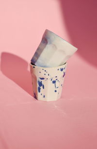 Close-up of pink tea cup on table