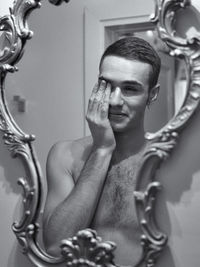 Close-up of shirtless young man