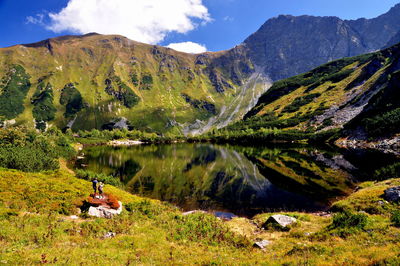Scenic view of lake against cloudy sky