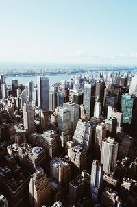 High angle view of modern buildings in city against sky