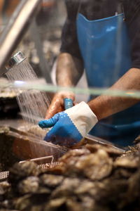 Midsection of man working in workshop