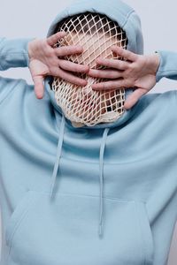 Midsection of woman holding umbrella