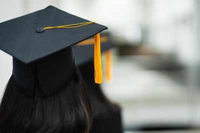 Close-up of person wearing hat