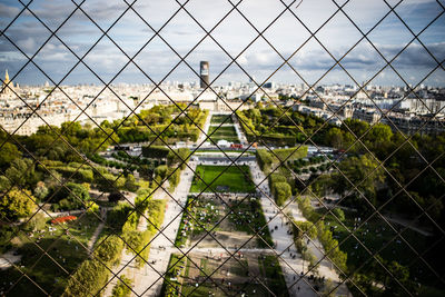 High angle view of park seen through chainlink fence