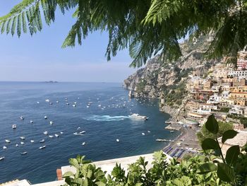 Leaf framed high angle view of sea and against sky of port in positano amalfi coast 