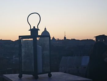 Silhouette historic building against sky during sunset