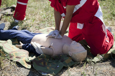 Low section of men lying on ground