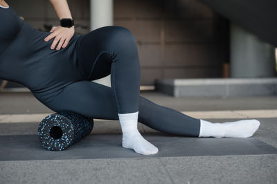 Low section of woman exercising in gym