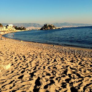 Scenic view of beach against clear sky