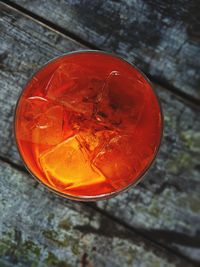 High angle view of orange glass against wall