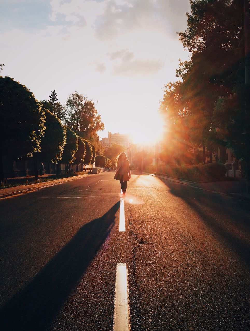 sunlight, sky, one person, road, nature, tree, transportation, real people, plant, sunset, direction, rear view, sun, lens flare, full length, lifestyles, sunbeam, the way forward, shadow, leisure activity, outdoors, bright, brightly lit