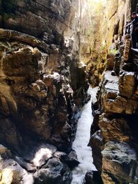 Stream flowing through rocks in cave