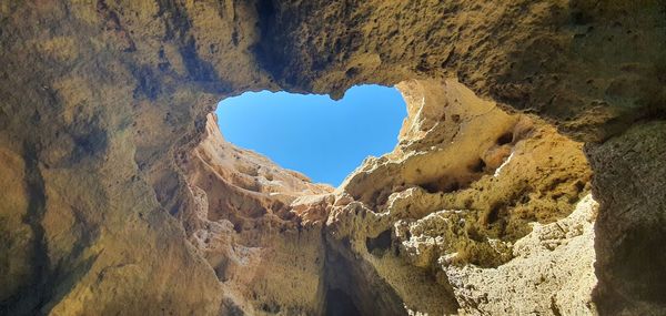 Low angle view of rock formation against sky