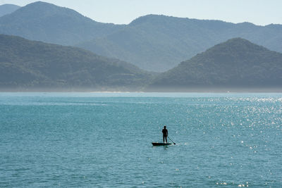 Scenic view of sea against mountains