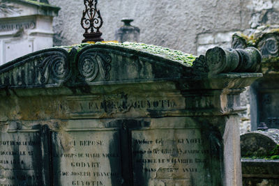 Low angle view of text on old building