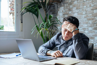 Young businesswoman working on table