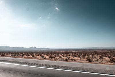 Road by land against sky