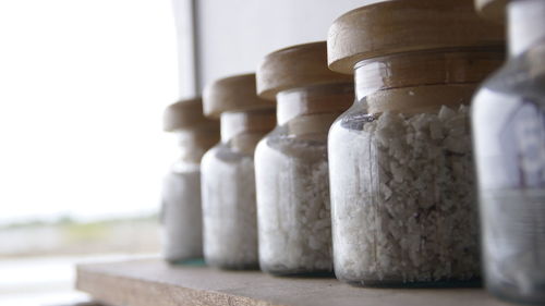 Close-up of food in glass jars on table