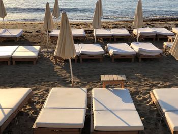 Chairs on beach by sea