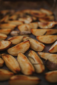 Close-up of roasted potatoes on table