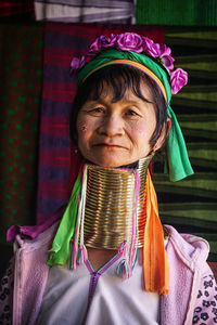 Portrait of woman with multi colored flowers