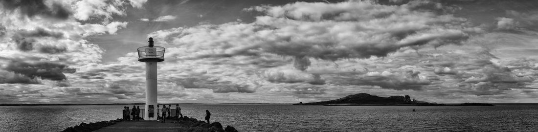 Scenic view of sea against cloudy sky