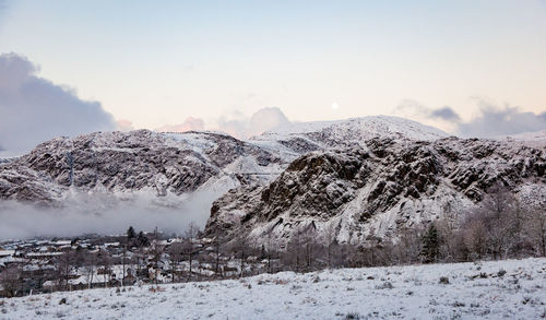 Snow covered mountain against sky